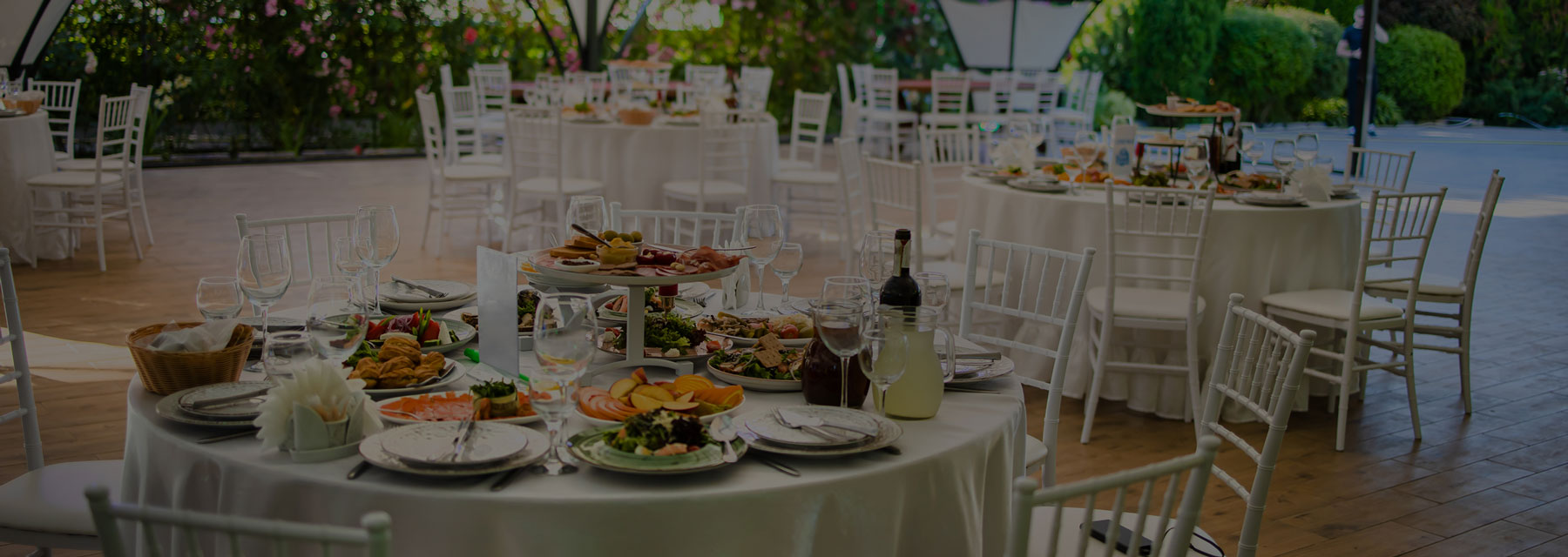 Tables setup full of food and drinks for event